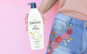 A person Holding a Jergens Skin Firming Body Lotion