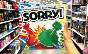 A person holding a Hasbro Classic Sorry Board Game 1