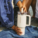 A person holding a Leakproof ProTour Flip Straw Tumbler