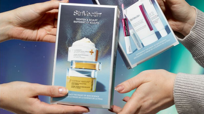 A person holding a box of StriVectin Tighten Sculpt Duo Kit