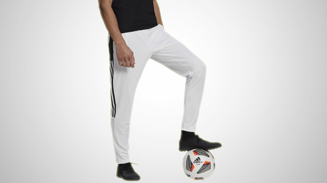 A person wearing a Adidas Tiro Mens Tapered Track Pants 1