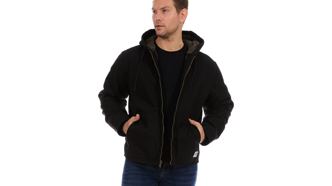 A person wearing a Bass Creek Outfitters Mens Canvas Work Jacket