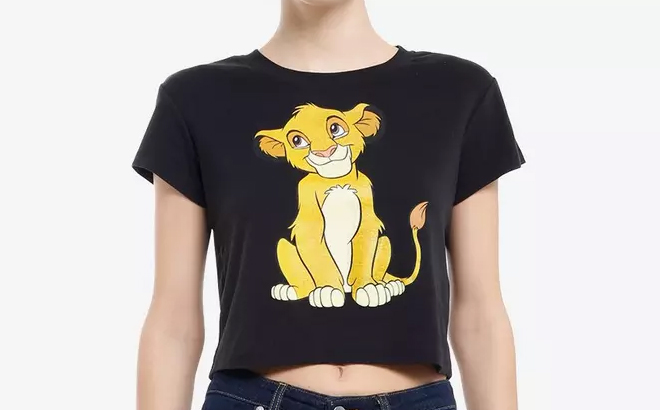 A person wearing a Disney The Lion King Girls Baby T Shirt