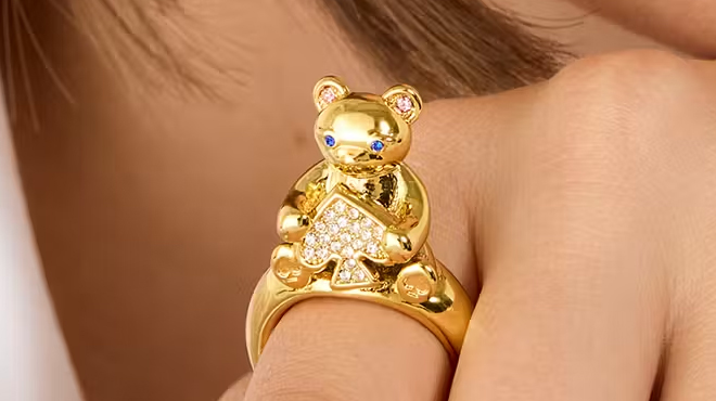 A person wearing a Kate Spade Teddy Bear Ring