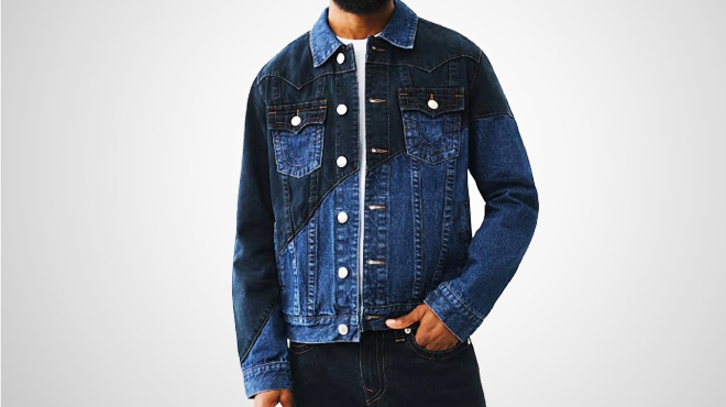 A person wearing a True Religion Seam Denim Jacket