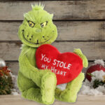 Aurora Whimsical Dr Seuss Stole My Heart Grinch Stuffed Animal on the Table