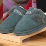 Bearpaw Linda Suede Slippers on a Product Stand