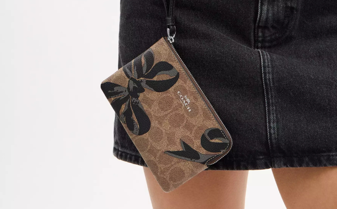 Coach Outlet Corner Zip Wristlet In Signature Canvas With Bow Print