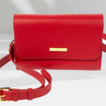 Convertible Leather Belt Bag in Cherry Red Color on a Table