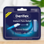 DenTek Instant Oral Pain Relief Maximum Strength Kit 50 Count on a Table