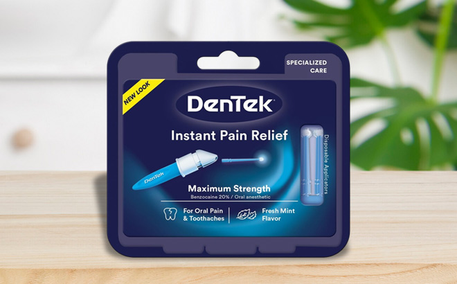 DenTek Instant Oral Pain Relief Maximum Strength Kit 50 Count on a Table