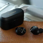 Earbuds on a Leather Surface