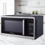 Farberware Classic 900 Watt Microwave Oven on a Kitchen Countertop