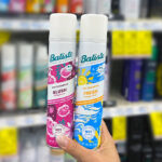 Hand holding Batiste Dry Shampoos