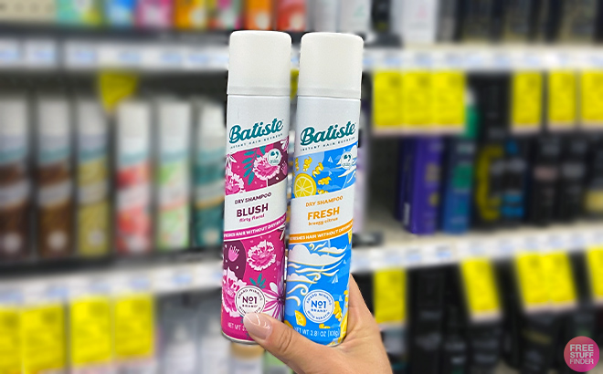 Hand holding Batiste Dry Shampoos