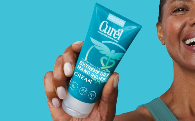 Hand holding Curel Dry Hand Relief Cream