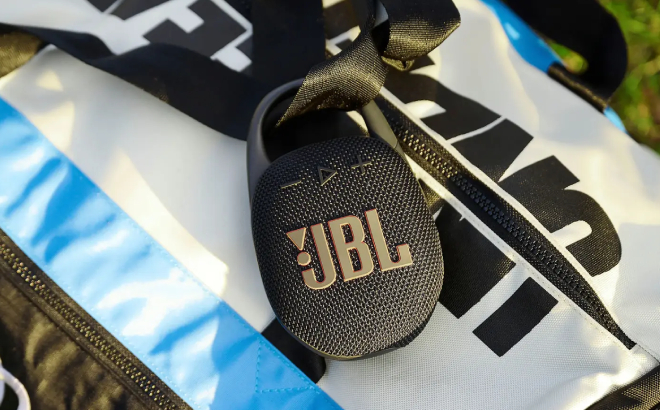 JBL Clip 5 Portable Wireless Bluetooth Speaker Clipped on a Bag