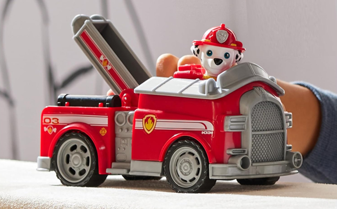 Kid Playing With Paw Patrol Truck