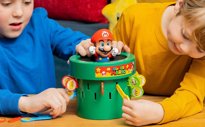 Kids PLaying Tomy Pop Up Super Mario Kids Game