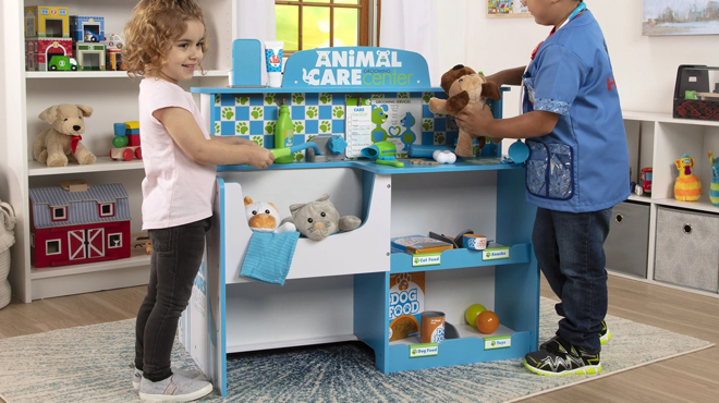 Kids playing with Melissa Doug Animal Care Veterinarian and Groomer Wooden Activity Center