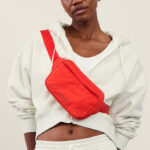 Model Wearing Red Athleta Belt Bag