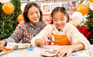 Mother and Daughter Participating in Home Depot Kids Workshop