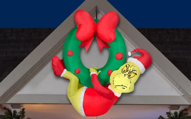 The Grinch Christmas Airblown Inflatable Hanging from a Wreath