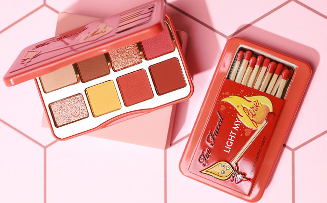 Too Faced Light My Fire Mini Eyeshadow Palette on a Pink Background