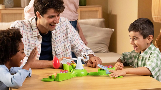 Two kids playing with Bluey Keepy Uppy Game