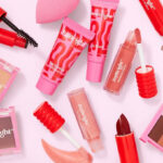 Various JoyBright Makeup Products on a Pink Background