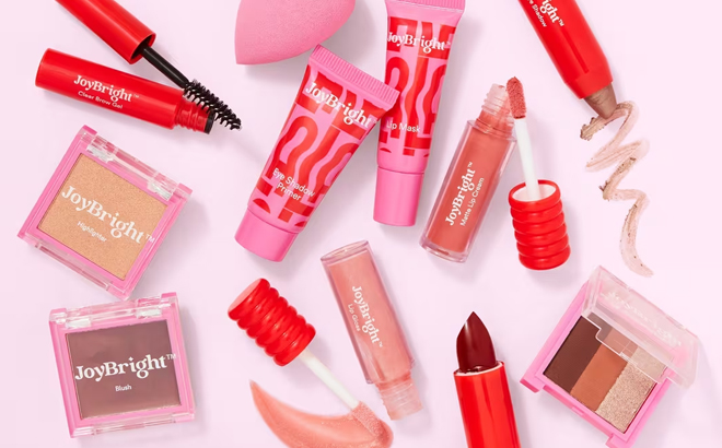 Various JoyBright Makeup Products on a Pink Background