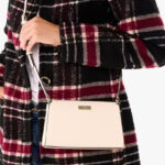 a Person Holding Kate Spade Kenzie Mini Crossbody