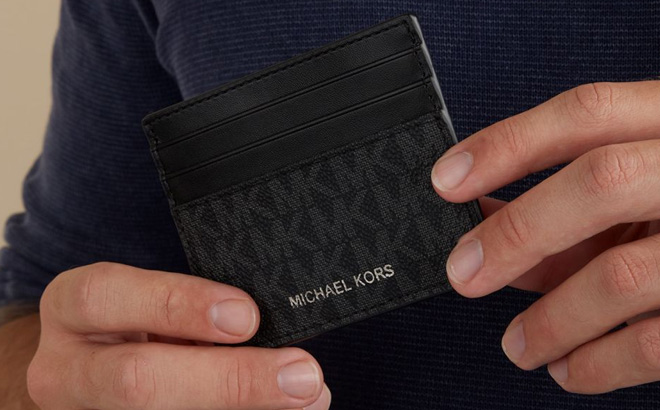 a Person Holding Michael Kors Greyson Logo Tall Card Case