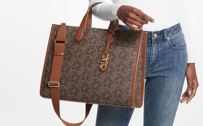 a Person Holding Michael Kors Logo Tote Bag