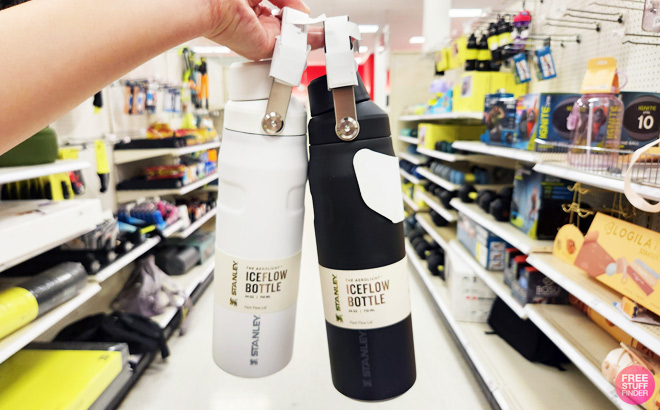 a Person Holding Stanley Iceflow Bottles