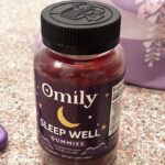 A Bottle of Omily Sleep Well Gummies on a Countertop