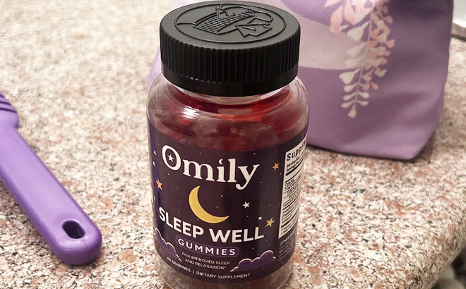 A Bottle of Omily Sleep Well Gummies on a Countertop