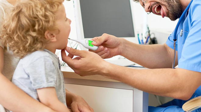 A Doctor Checking a Childs Temperature Using a Basal Thermometer