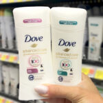 A Hand holding Dove Advanced Care Clear Finish Deodorant Stick and Dove Advanced Care Sheer Cool Deodorant Stick