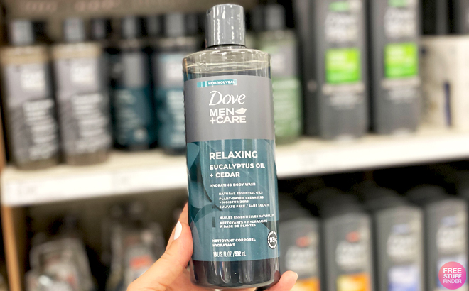 A Hand holding Dove MenCare Body Wash