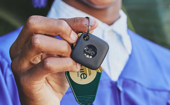 A Hand holding a Tile Mate Tracker