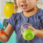 A Kid Holding Learning Resources Sensory Fidget Tubes