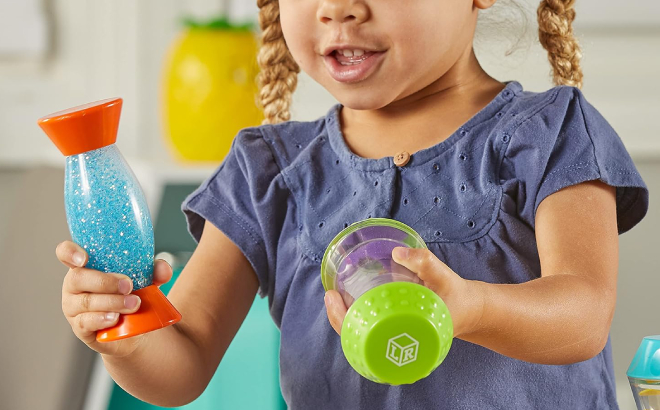 A Kid Holding Learning Resources Sensory Fidget Tubes