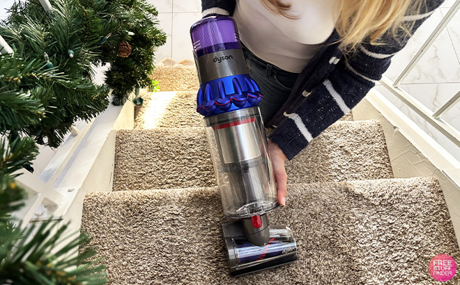 A Person Cleaning Stairs with Vacuum