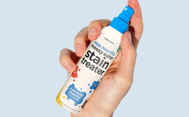 A Person Holding Miss Mouths Messy Eater Stain Treater Spray