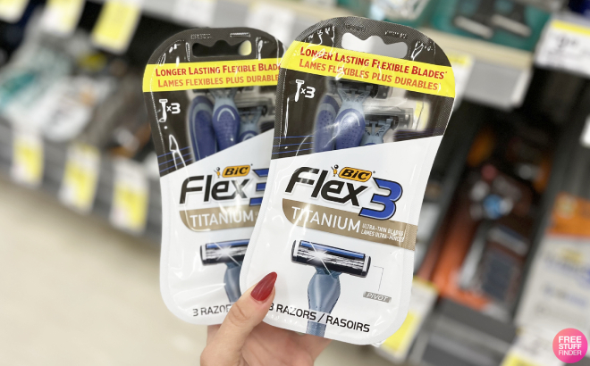 A Person Holding Two Packs of Bic Flex 3 Titanium Razors