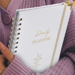 A Person Holding Undated Daily Planner