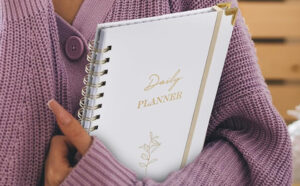 A Person Holding Undated Daily Planner