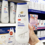 A Person Holding a Bottle of Dove Deep Moisture Body Wash