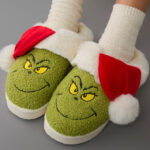 A Person Wearing AE Grinch Scuff Slippers